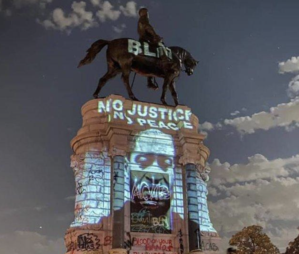 An image of George Floyd was projected on the base of the statue of Confederate General Robert E. Lee on Monument Avenue in Richmond, VA.