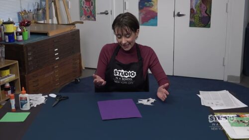 woman teacher with supplied in front