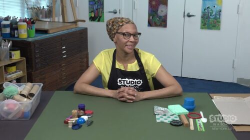 teacher with supplies in front of them on a table