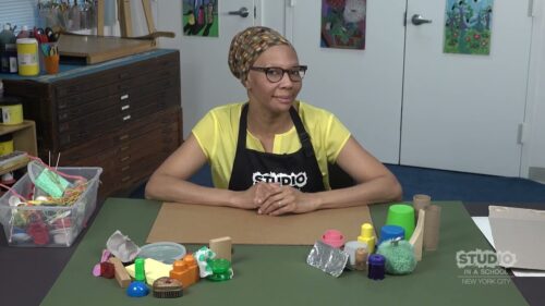 teacher with supplies in front of them on a table