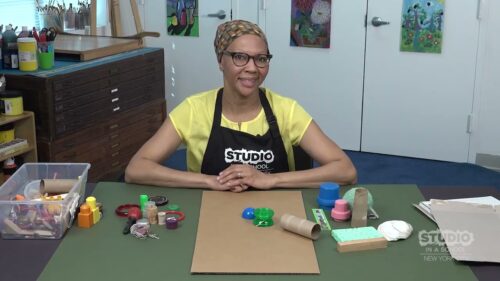 teacher with supplies in front of them on a table
