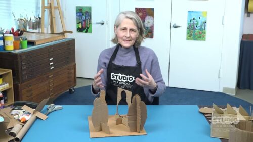 teacher with supplies in front of them on a table