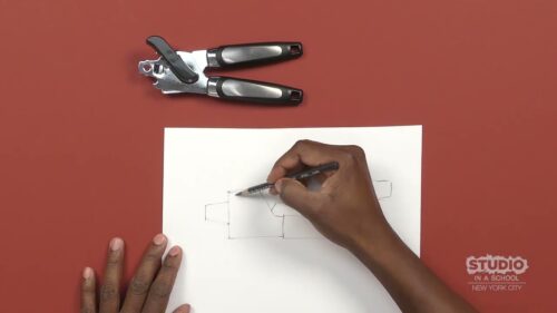 dark skinned hands drawing on a white sheet of paper with a compass above